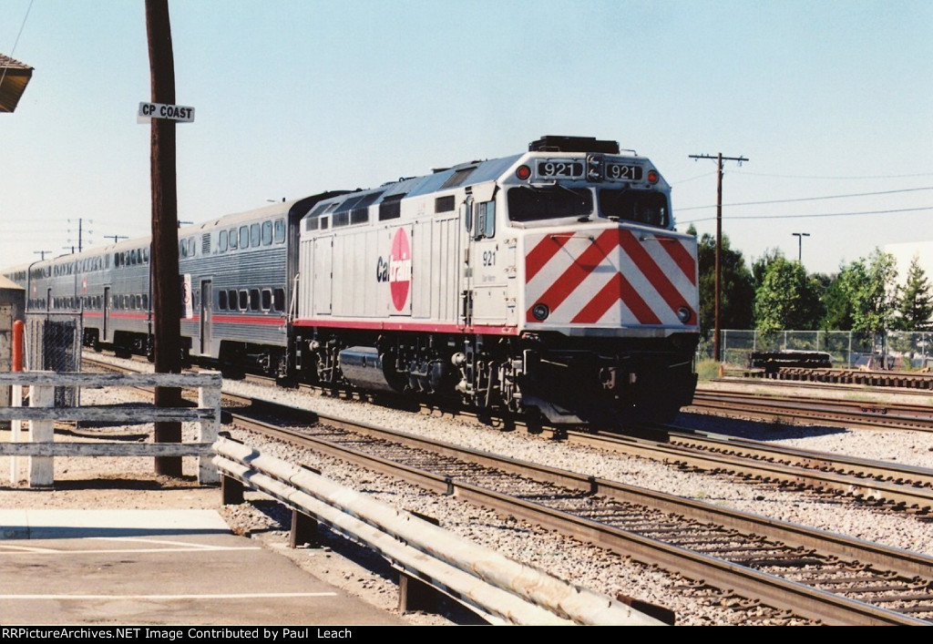 Commuter train shoves west out of the station